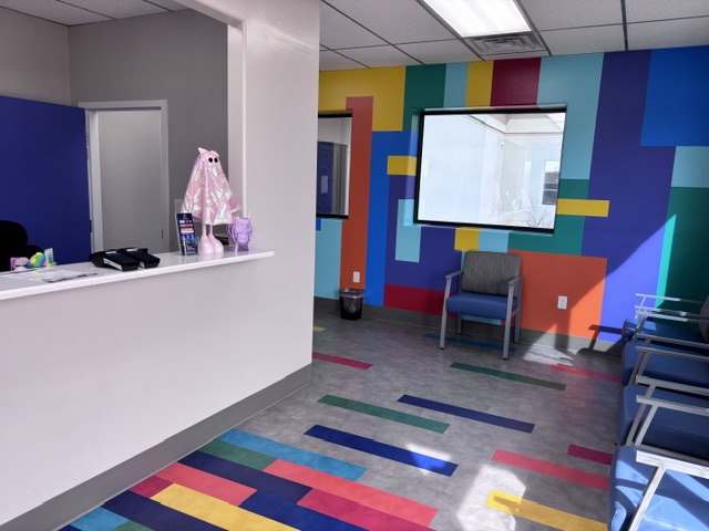 Front desk and playful waiting space at our Clovis urgent care clinic